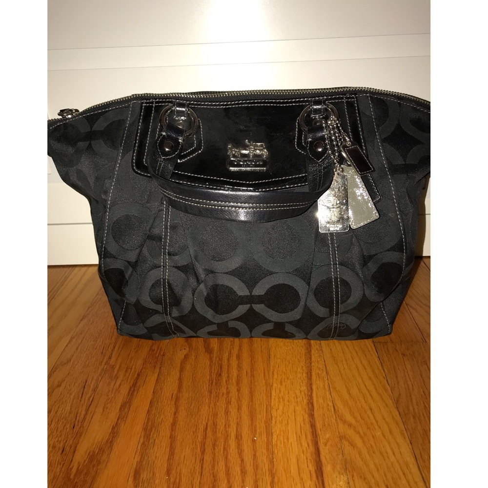 Black modern C Coach tote bag. Good condition.